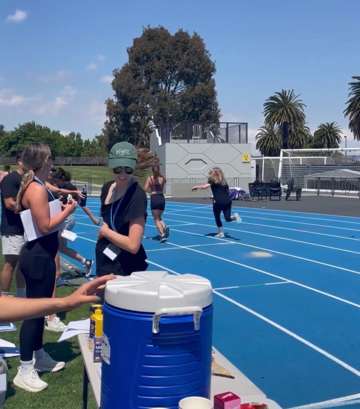 Meg at a sports event on an athletics track